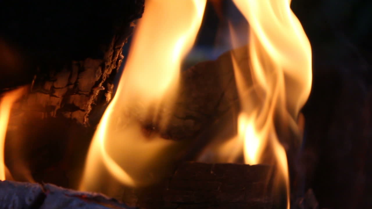 Close Up Of Big Outdoor Bonfire. Close up shot of a fire and firewood burning in outdoor