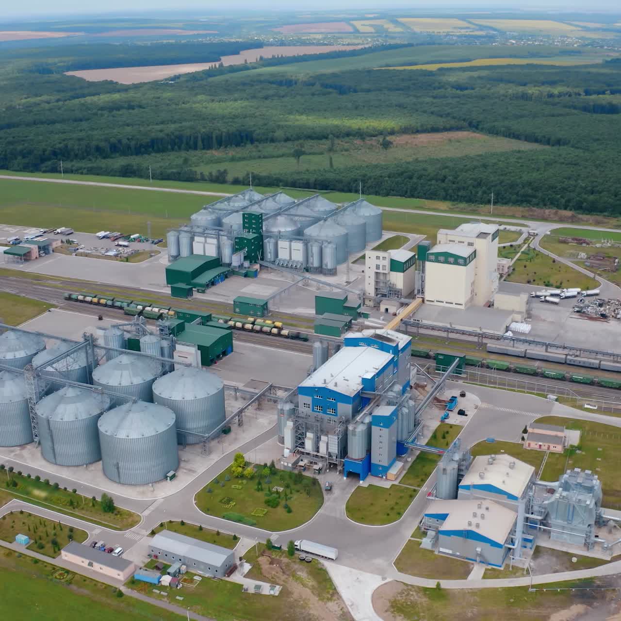 Agricultural huge metal factory storages. Big territory of farming storage warehouses