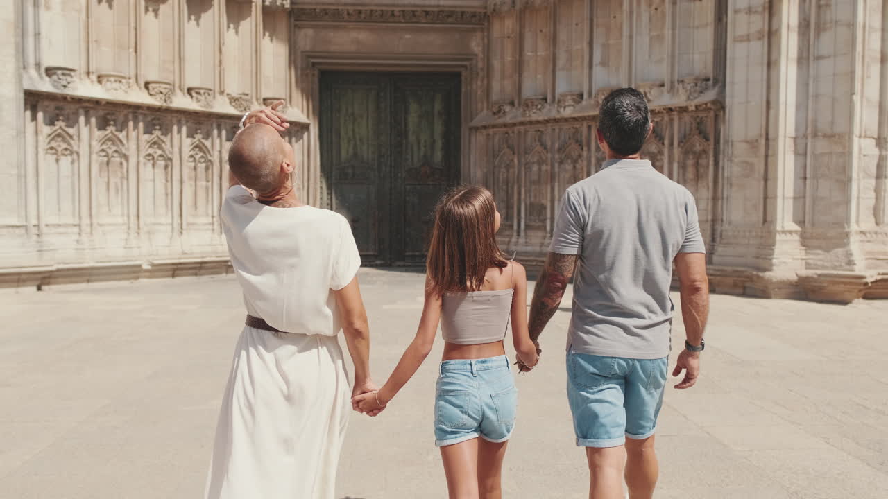 Happy Family Walking Hand in Hand Towards a Grand Cathedral