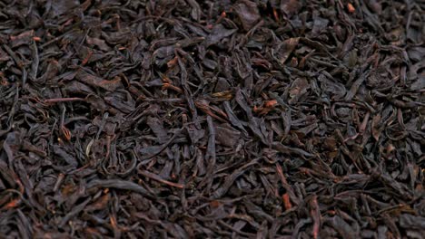 looped spinning dry black tea full frame close-up background