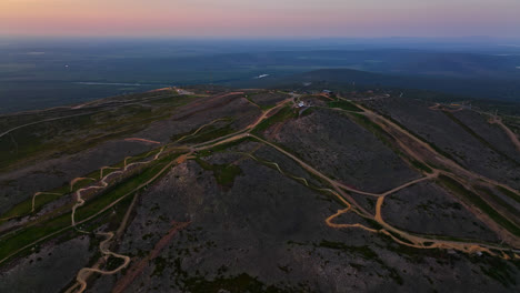 AERIAL:-top-of-the-Levi-mountain,-during-midnight-sun-in-Lapland,-Finland