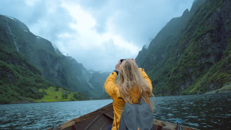 exploring a norwegian fjord in a wooden boat