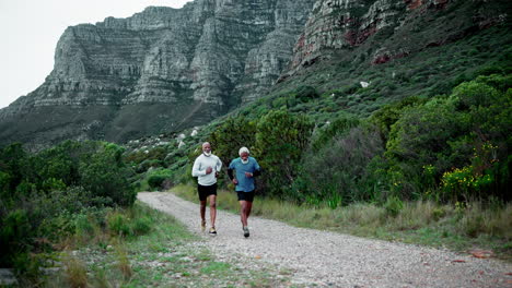 senior men running on a mountain trail