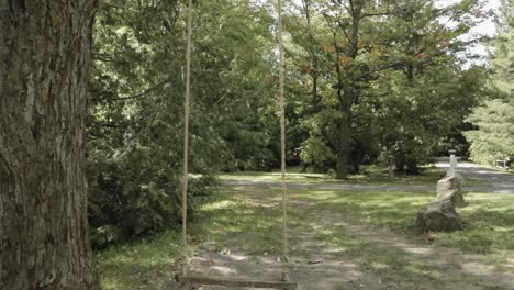 Rope-swing-in-the-back-yard-of-a-heritage-school-house-in-Ottawa,-Canada