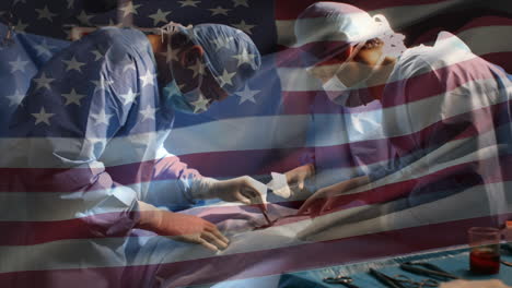 animation of flag of usa waving over surgeons in operating theatre