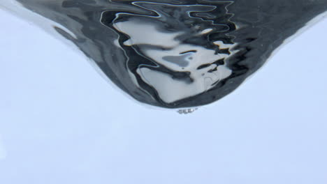 beverage whirlpool rotating inside vessel closeup. clean liquid swirling moving