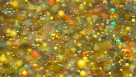 slow motion bright colors bubbles oil beautiful paint universe color moving multicolored closeup. acrylic paint. fantastic surface. abstract colorful paint metamorphosis structure colorful bubbles