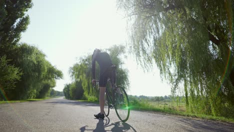 Confused-cyclist-on-the-empty-road-looking-on-sides