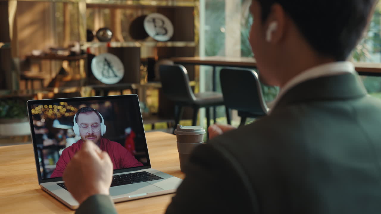 Businessman having a video call in a coffee shop