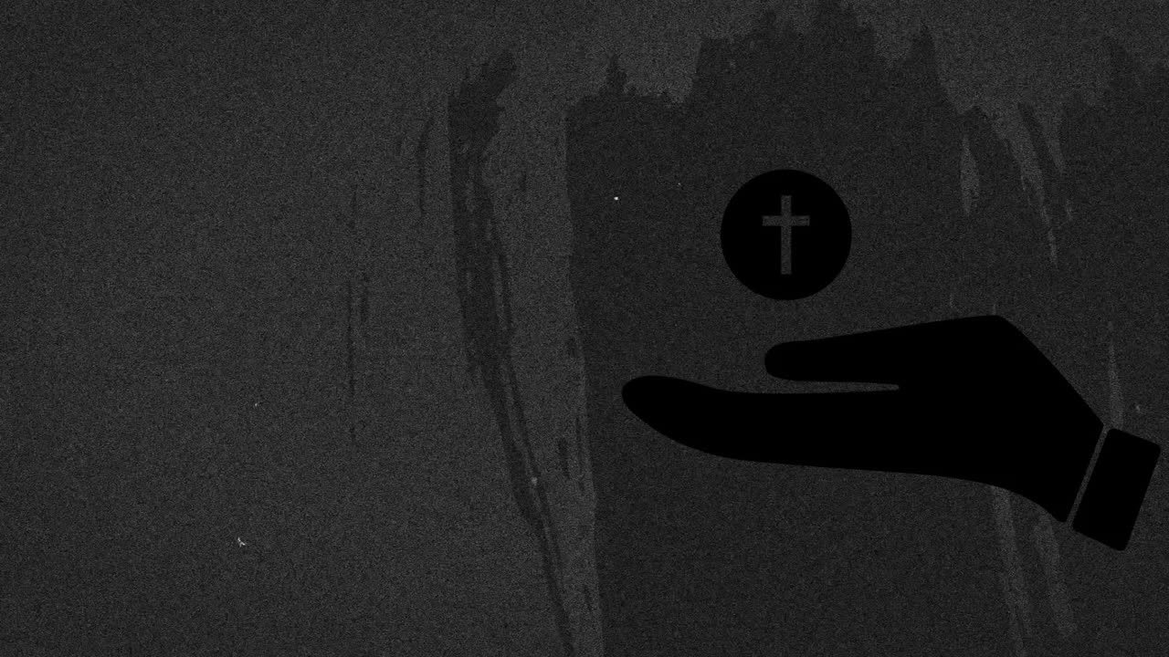 Holding cross symbol, hand silhouette against dark textured background