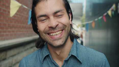 happy man in an urban alley