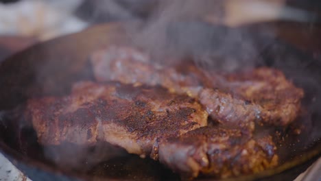 Meat-Smoking-in-Cast-Iron-Skillet,-Handheld-Close-Up