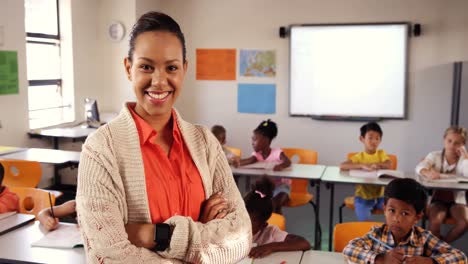 Teacher-adjusting-smart-watch-in-classroom