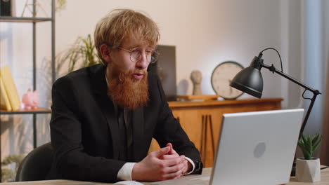 businessman working on laptop at office talk on online communication video call with employee boss