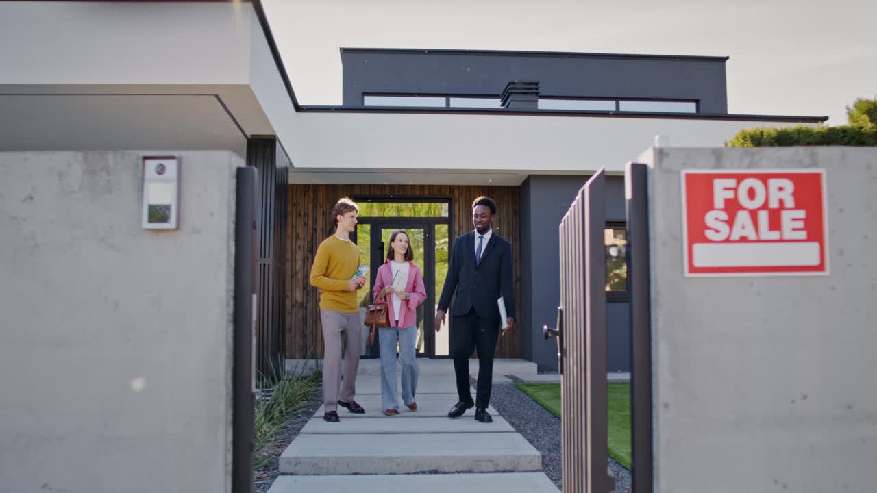 Potential home buyers being shown house for sale.