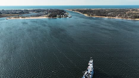 High-altitude-look-at-a-large-tug-boat-in-Muskegon-Lake