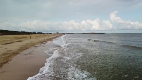 Shot-Aerial-Drone-Shot-of-the-Waves-at-Gorleston-On-Sea-Beach,-Norfolk