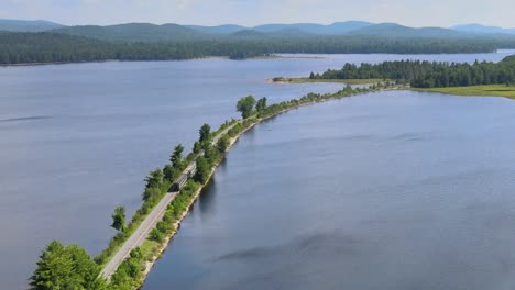 Drone-shot-of-a-train-going-north-through-the-Adirondack-park-in-upstate-New-York