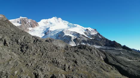 aerial dollies past summit peak of huayna potosi mountain in bolivia