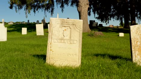 Drone-Trucking-shot-of-a-headstone-of-Luman-Walters-at-Gorham-Cemetery