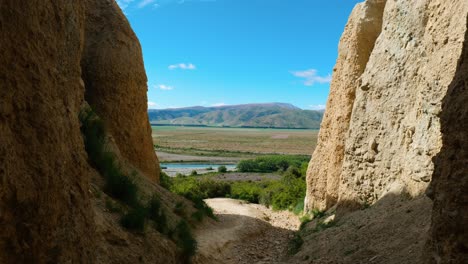 Mesmerizing-view-through-a-gap-in-the-Clay-Cliffs,-revealing-unique-rock-formations-and-stunning-landscapes