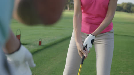 two golfers playing golf together