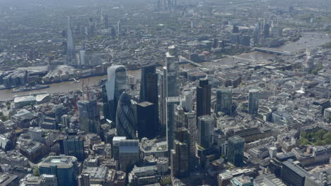 high establishing drone shot over london skyscrapers and city centre