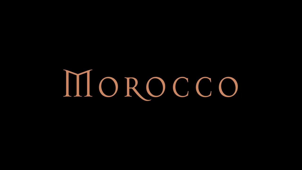 Slow motion of written text Morocco which vanishes like sand in the wind