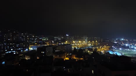 Aerial-Hyperlapse-Barcelona-City-at-Night-Hebron-Valley-Park-Serra-de-Collserola-Spain-Drone-Shot,-Catalonia