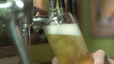 tapping beer in a pub