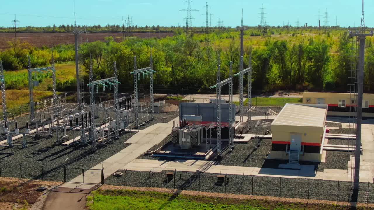 Modern plant equipment, solar station. Fenced area of the solar station with photovoltaic equipment. Circular movement of the camera. Aerial view. 4k, ProRes