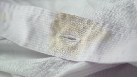 dirty stain on a purple and white striped shirt collar