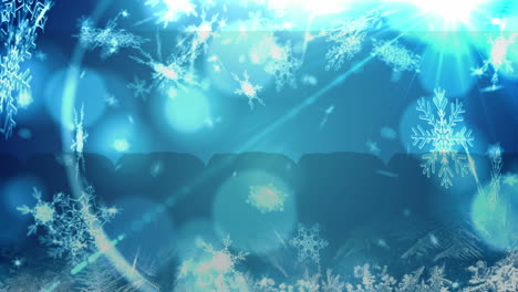 animation of christmas snow falling over christmas bauble decorations on blue background