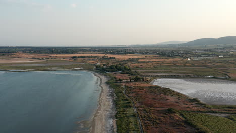 Aerial-drone-footage,-pond-beach-near-Montpellier,-France