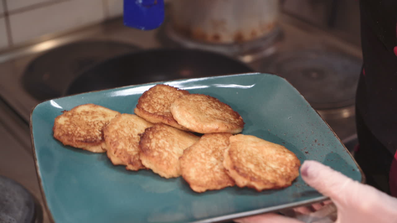 Potato pancakes. Vegetable pancakes. Latkes in the frying pan