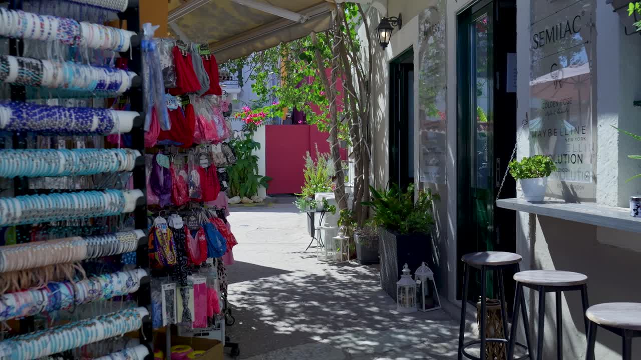 Charming European Alleyway with Shops and Motorbikes