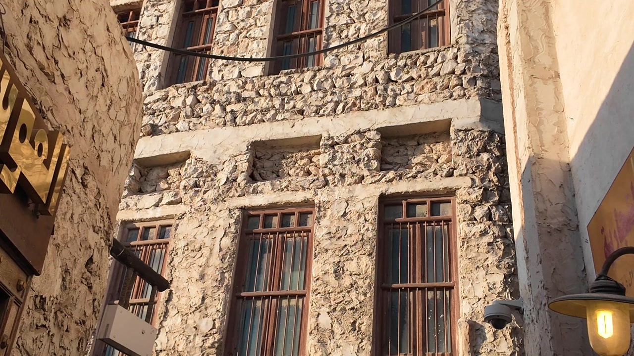 Sunlight on Old Stone Buildings in a Traditional Arabian Alley