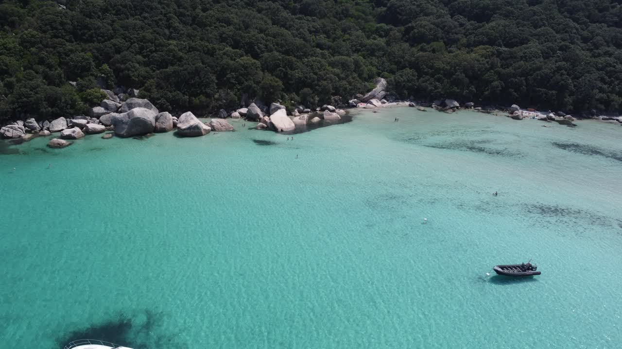 Beautiful rocks in clear water drone shot, Plage de Santa Giulia, Corsica