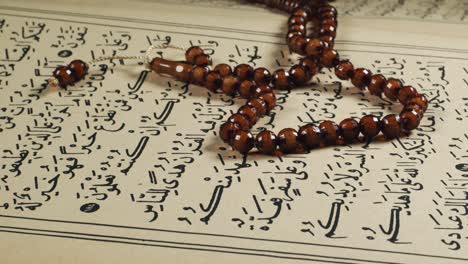 prayer beads on the Quran Page