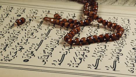 prayer beads on the quran page