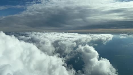 Cockpit-view-of-spring-cumulus-clouds-in-the-afternoon-light