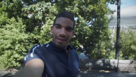 man having video chat on phone outside, showing surroundings