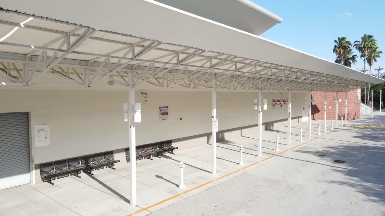 dramatic railcam view of an empty cruise ship terminal without people