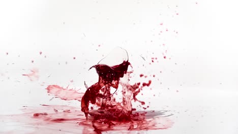 Breaking-the-glass-of-red-wine-in-slow-motion-on-white-background