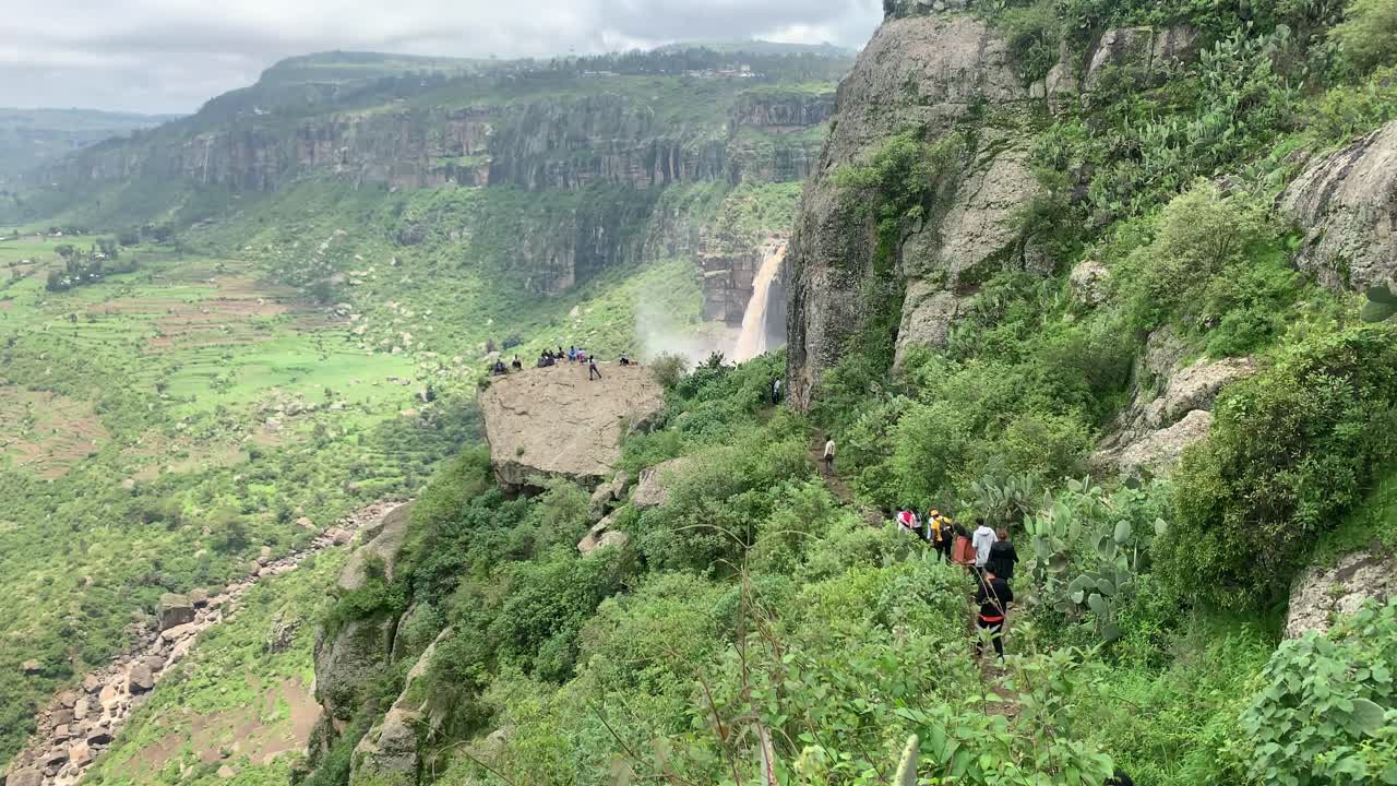 The hikers getting closer to their destination to the big rock of Debre Libanos, Debre Birhan waterfall to rest