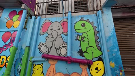 vivid street art and murals line the pedestrian walkways of seremban, malaysia. these artworks portray themes like culture, daily life, and history, reflecting the local community's essence.