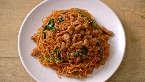 stir-fried instant noodles with thai basil and minced pork - asian food style