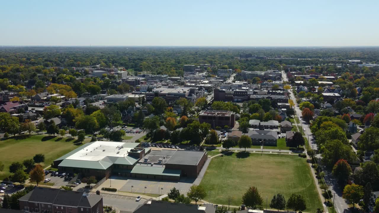 Naperville, IL, a Chicago suburb, on a sunny fall day, featuring buildings, streets. Crane Down Day S