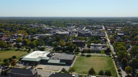 naperville, il, a chicago suburb, on a sunny fall day, featuring buildings, streets. crane down day s