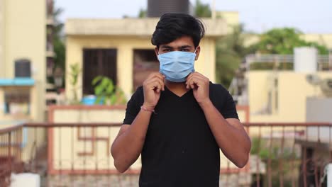 portrait of a young asian boy wearing protective mask and giving thumbs up sign mid shot.concept of health and safety life, n1h1 corona virus, virus protection, pandemic in world